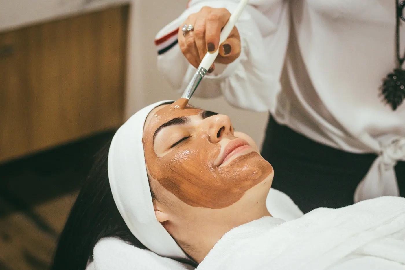 Client receiving a facial mask treatment at a beauty salon