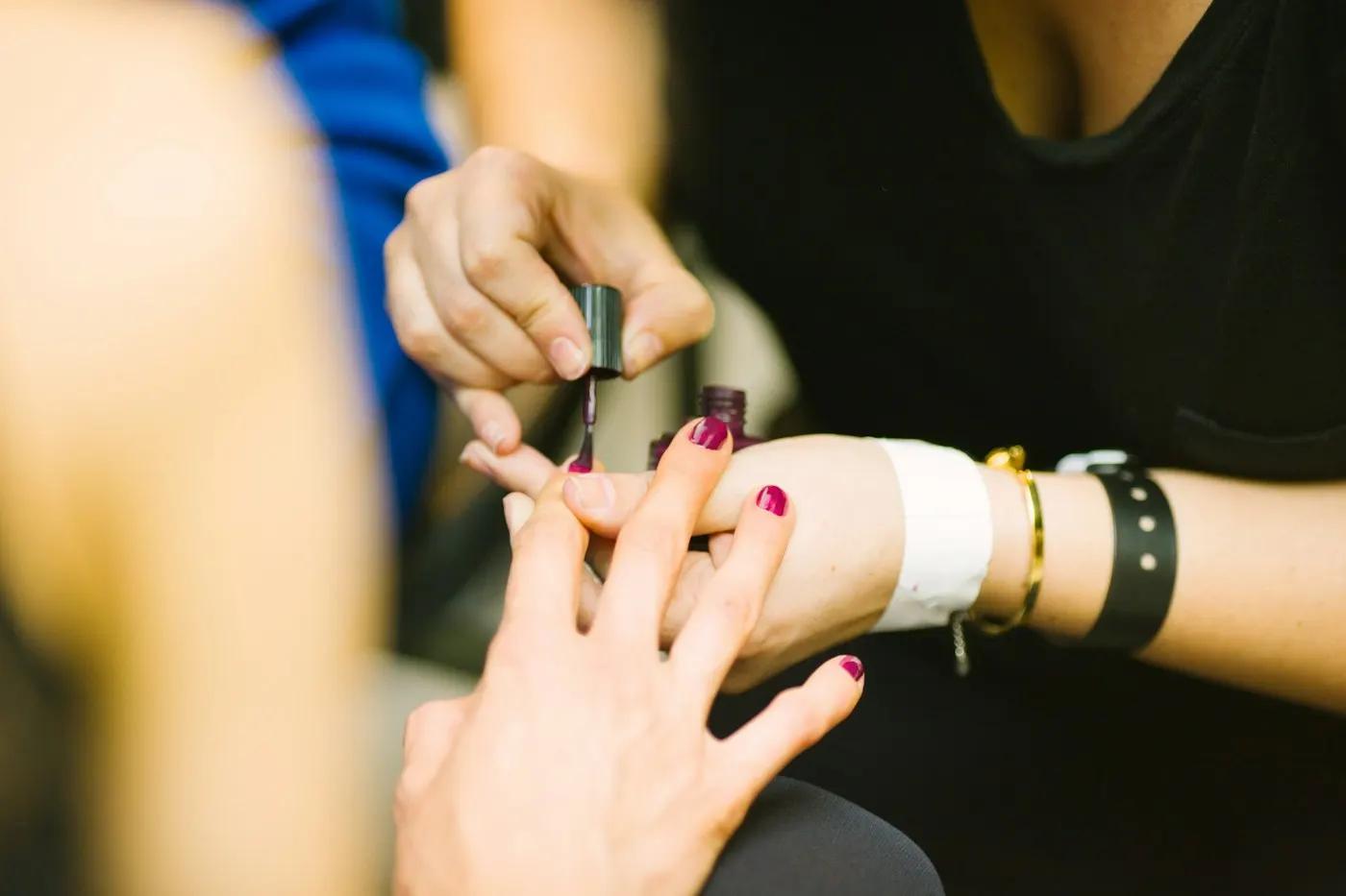 Manicure being done at a nail station